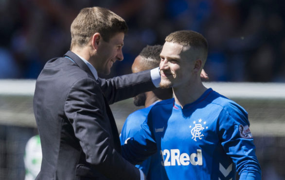 Rangers manager Steven Gerrard embraces Ryan Kent last season after beating Celtic