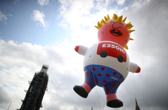 A blimp depicting Boris Johnson is launched in Parliament Square, London, ahead of a pro-European Union a march organised by March for Change.