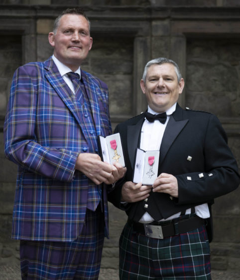 Rugby legend Doddie Weir and Tourette’s campaigner John Davidson after 
being made OBE and MBE respectively at Palace of Holyroodhouse in Edinburgh