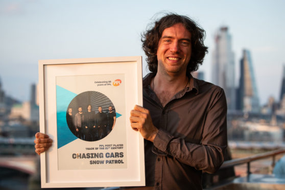 Frontman of Snow Patrol Gary Lightbody receives the award for Most Played song of the 21st century