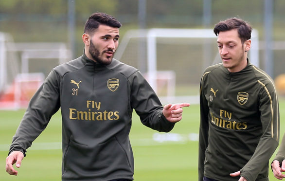 Arsenal's Sead Kolasinac (left) and Mesut Ozil