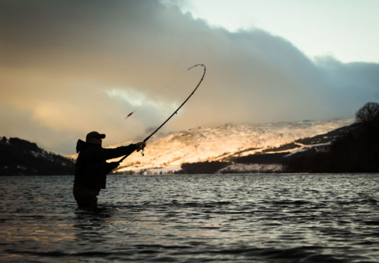 An angler at the mouth of the River Tay in Kenmore, Scotland, on the opening day of the salmon fishing season.