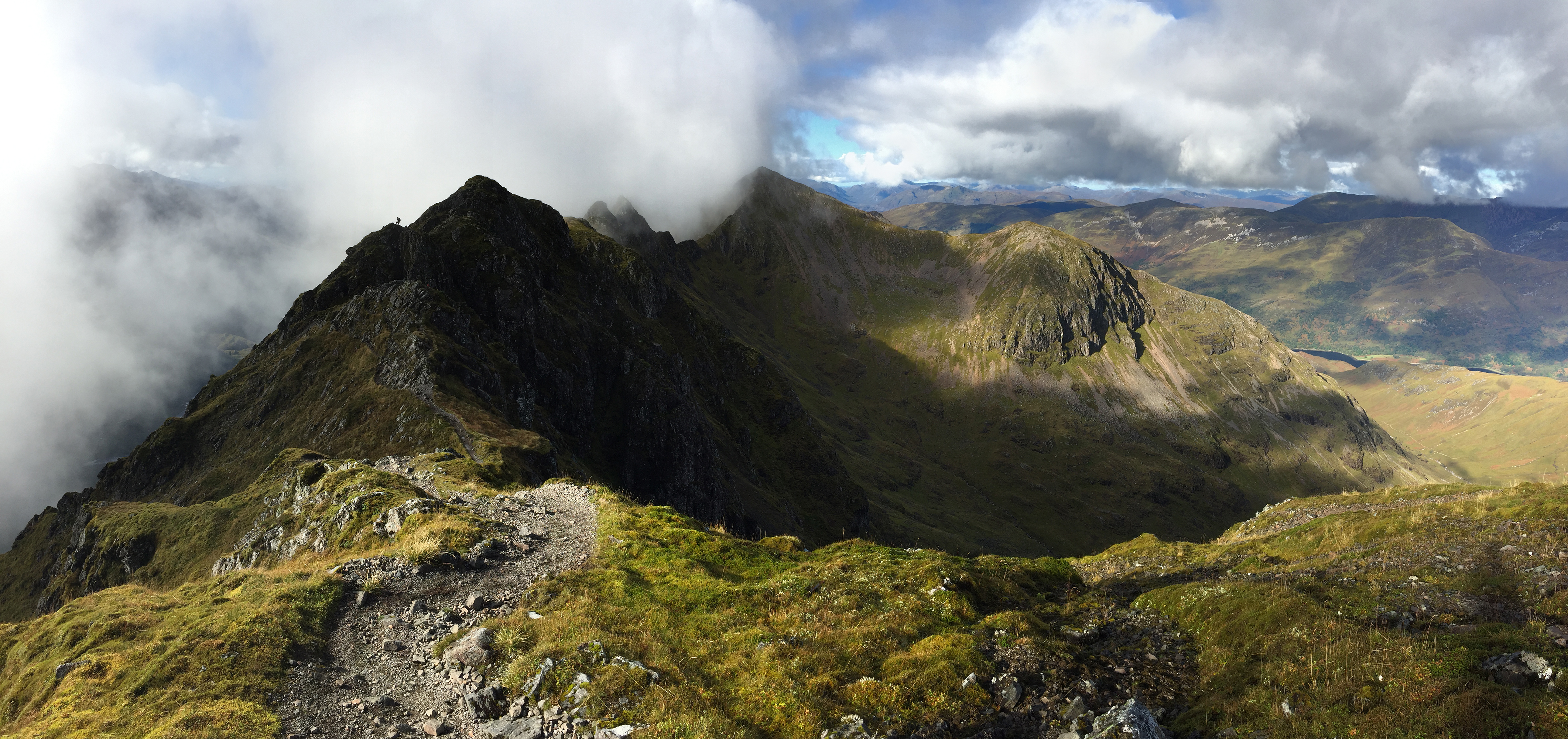 Panoramic view of the notoriously difficult Aonach Eagach mountain ridge in the Scottish Highlands.