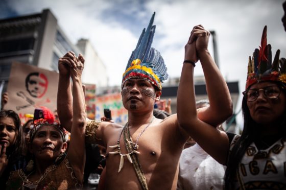 Climate activist groups protest in different Colombian cities to call on the Brazilian government to increase efforts to control and prevent wildfires at the Amazon rainforest in Bogota, Colombia on August 23, 2019.