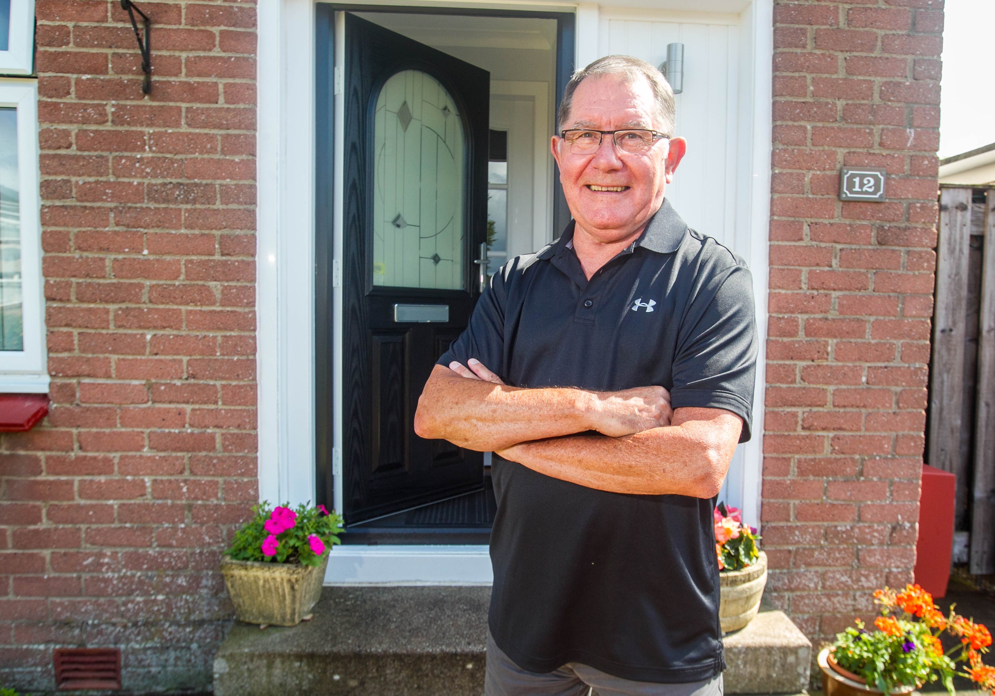 Brian Baxter at home after new door is fitted