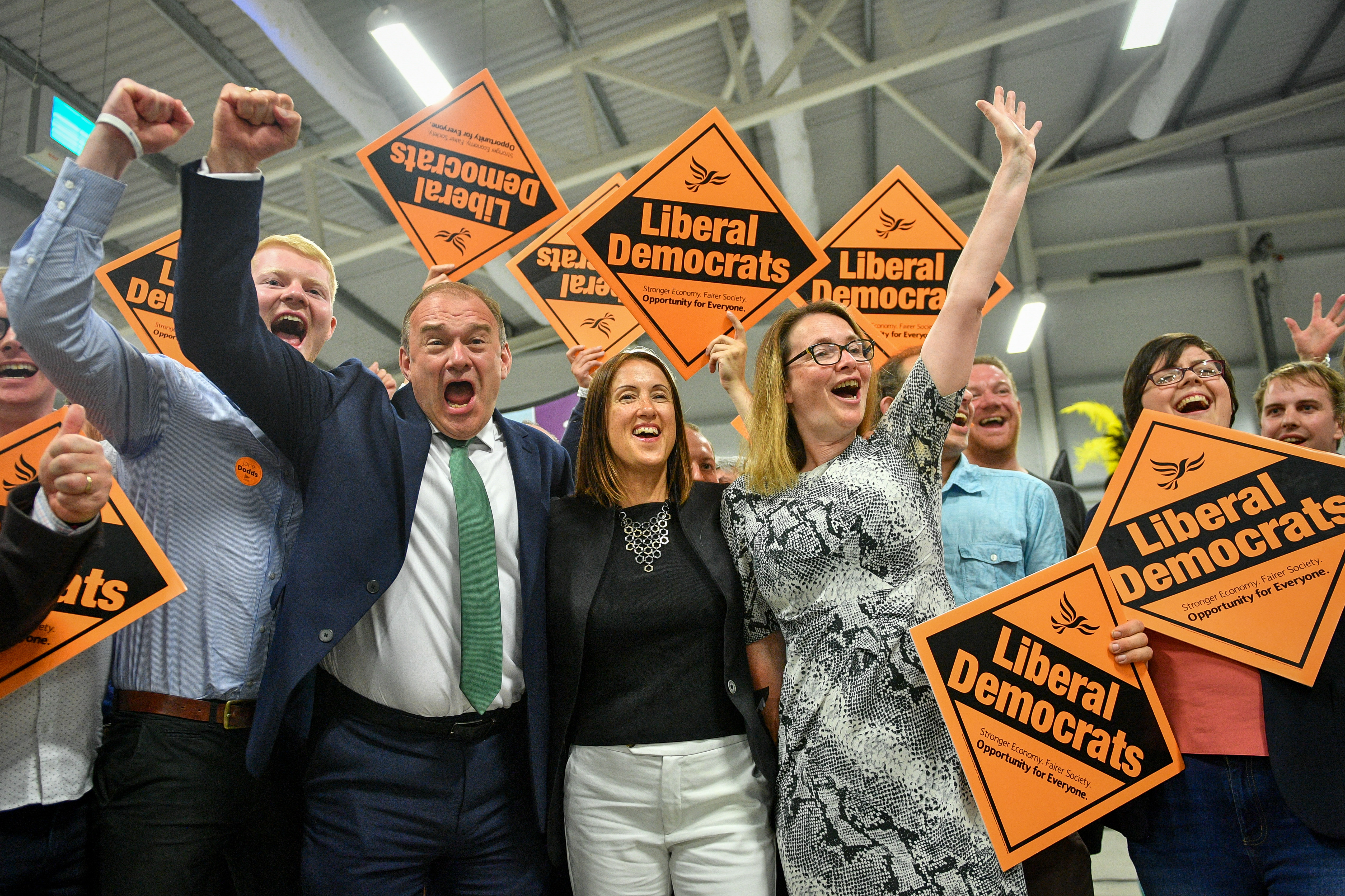 Liberal Democrat MP Jane Dodds, centre, celebrates with supporters as she wins the seat