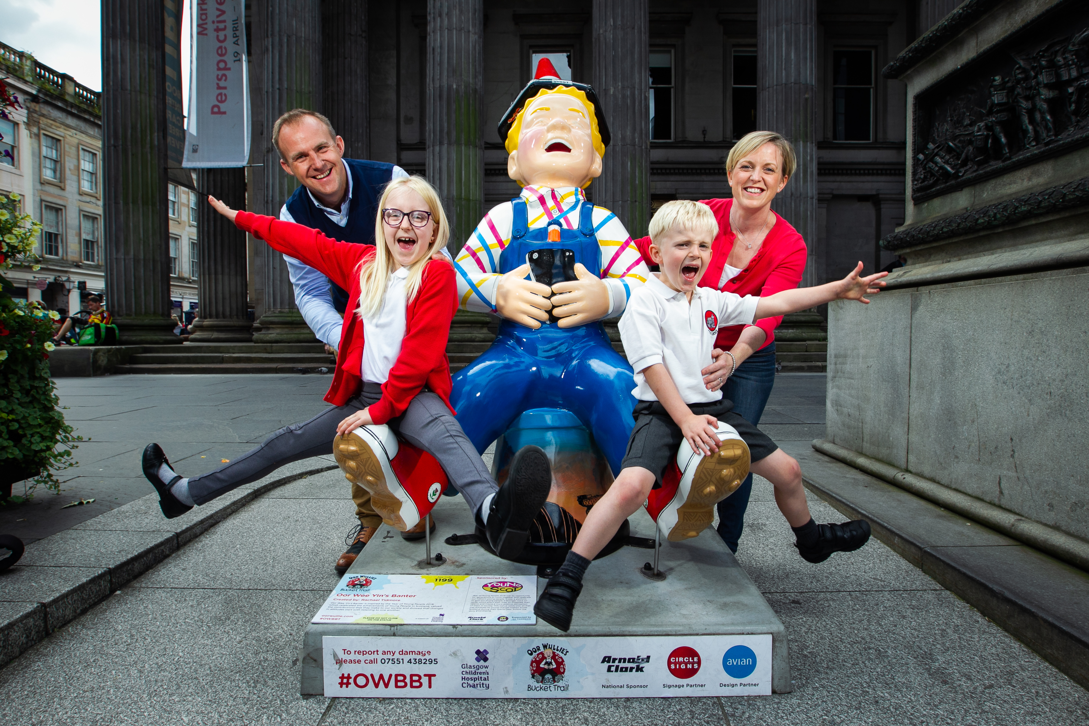 The Simpson Family; parents David and Kerry, with Eve (8), and Hamish (5), standing with the Oor Wullie statue in Royal Exchange Square, Glasgow. The family have spent the summer visiting every statue in Scotland as part of the Bucket Trail.
