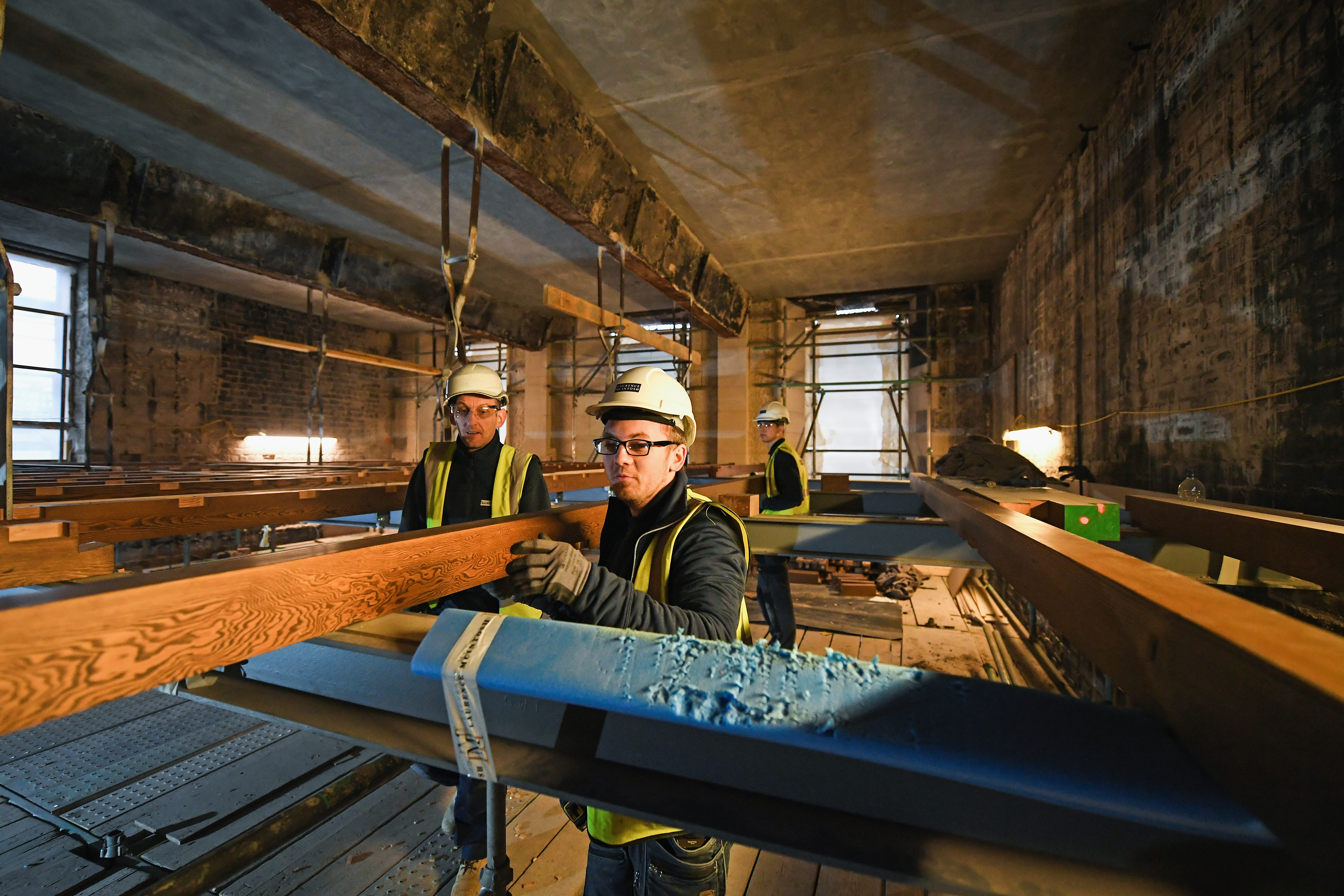 Specialist carpenters from Lawrence McIntosh install the floor to the bookstore above the Mackintosh Library on November 22, 2017 in Glasgow, Scotland.The original floor was suspended from beams above the book store by metal stirrups which survived the fire and are being retained in the restored building Restoration of Glasgow School.