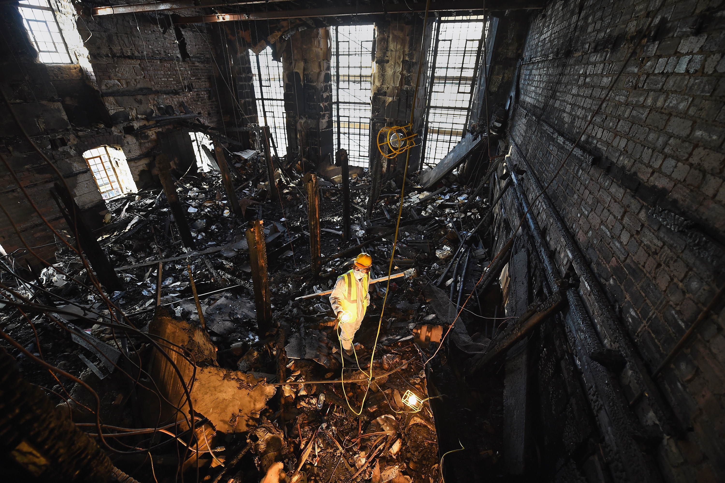A forensic archaeologist sifts through the ashes of famous Mackintosh library after the first fire in 2014