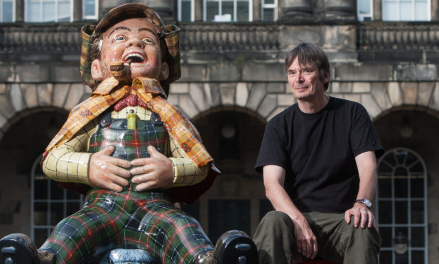 Author Ian Rankin supporting the Edinburgh Children's Hospital Charity with the Sherlock Holmes Oor Wullie Statue