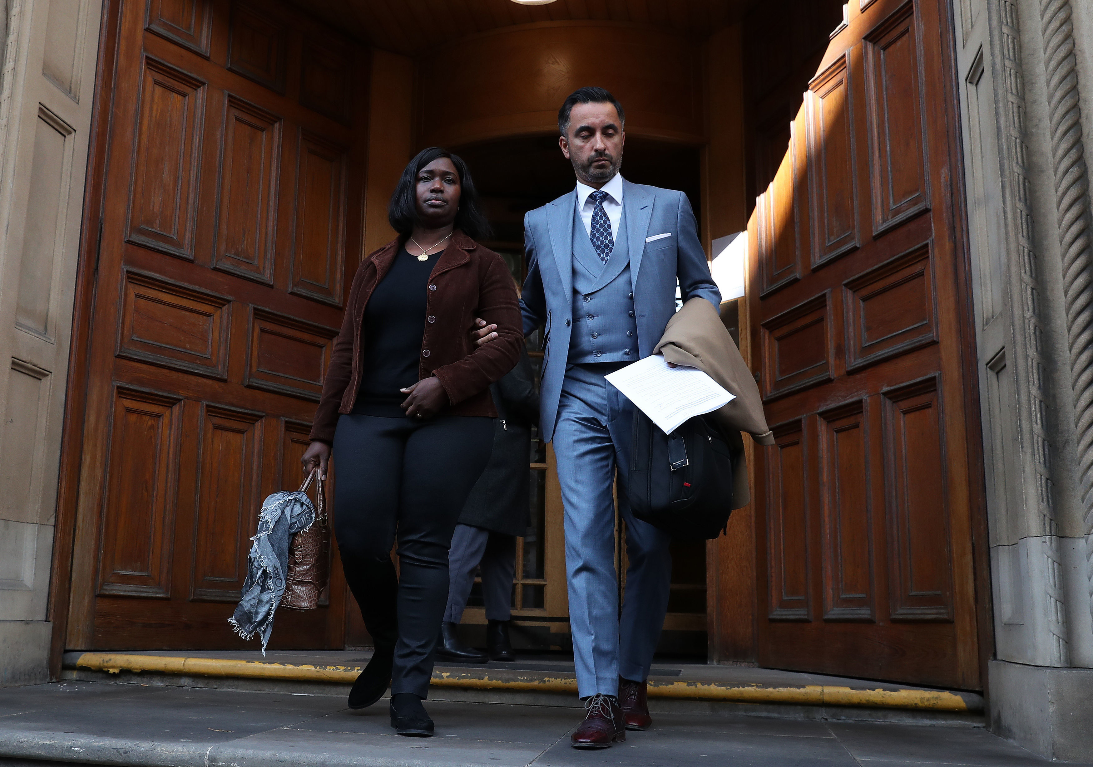 Kadijatu Johnson sister of Sheku Bayoh with lawyer Aamer Anwar as they arrive to speak to the media outside the Crown Office in Edinburgh. The family earlier met with Lord Advocate James Wolffe QC to hear his decision over prosecutions for the death of Mr Bayoh in police custody in 2015.