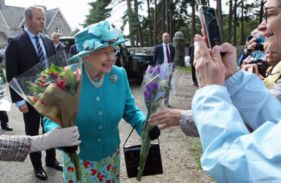 The Queen receives flowers yesterday
