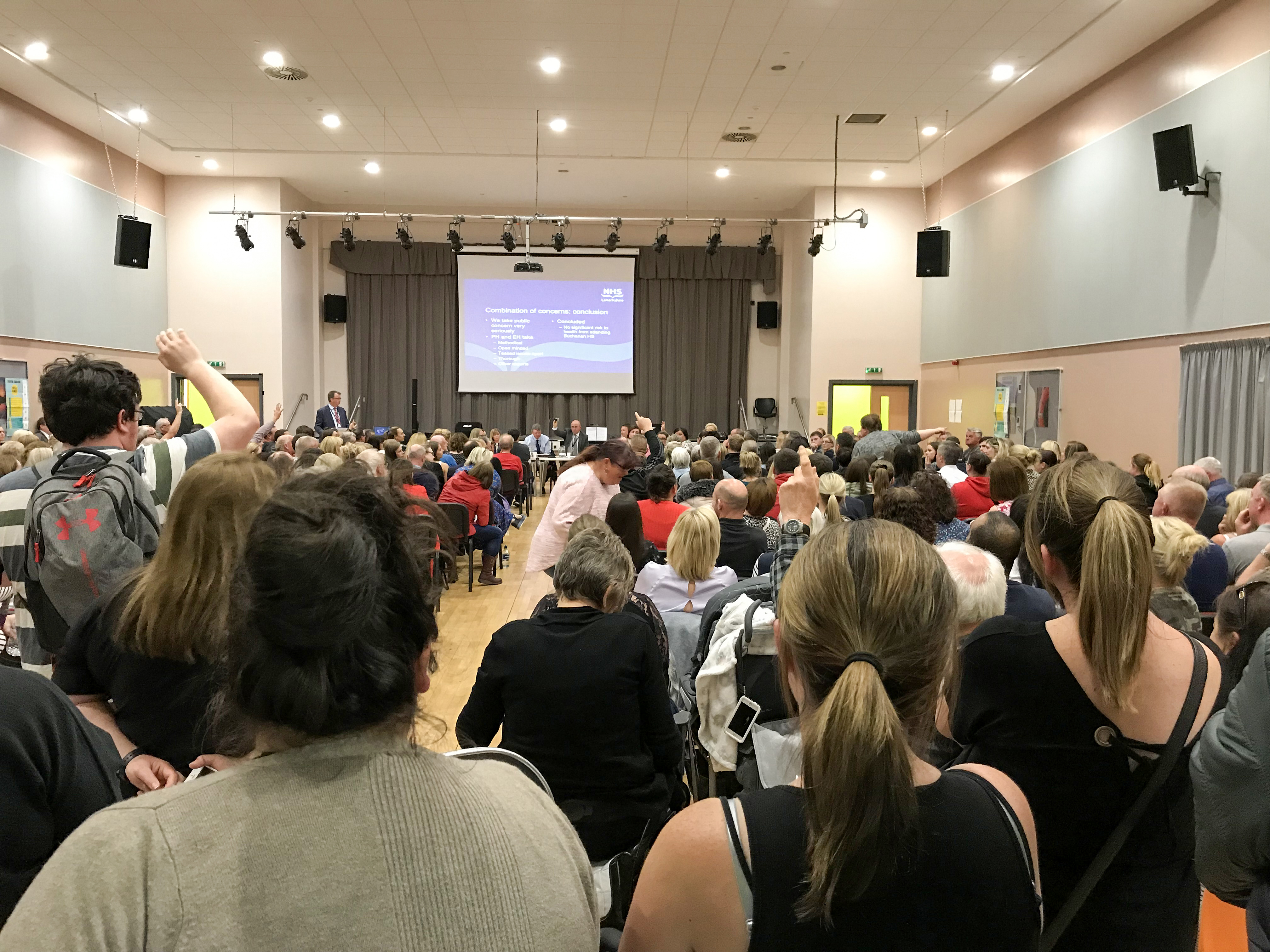 Parents pack into a public meeting at St Ambrose High in June when council and health board faced fierce criticism over handling of crisis