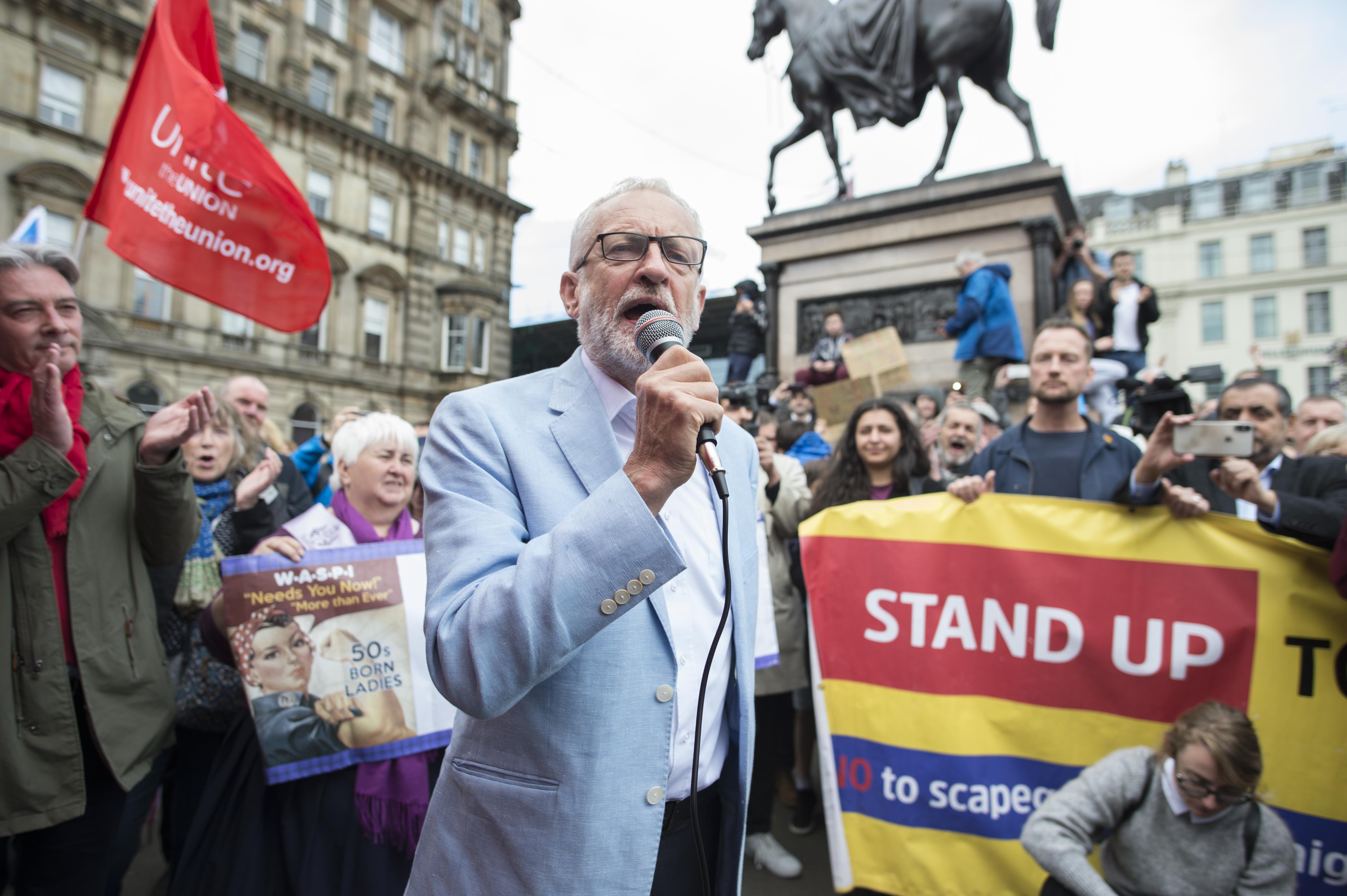 Thousands of protestors gathered in Glasgow's George Square yesterday for a "Stop the Coup" protest . Labour leader Jeremy Corbyn was one of the speakers at the rally