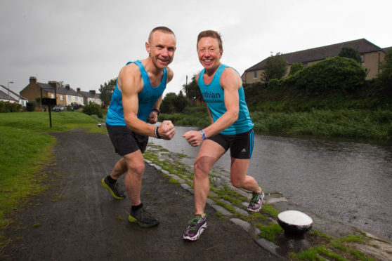 Shona Young and brother Paul have run more than 100 marathons each.