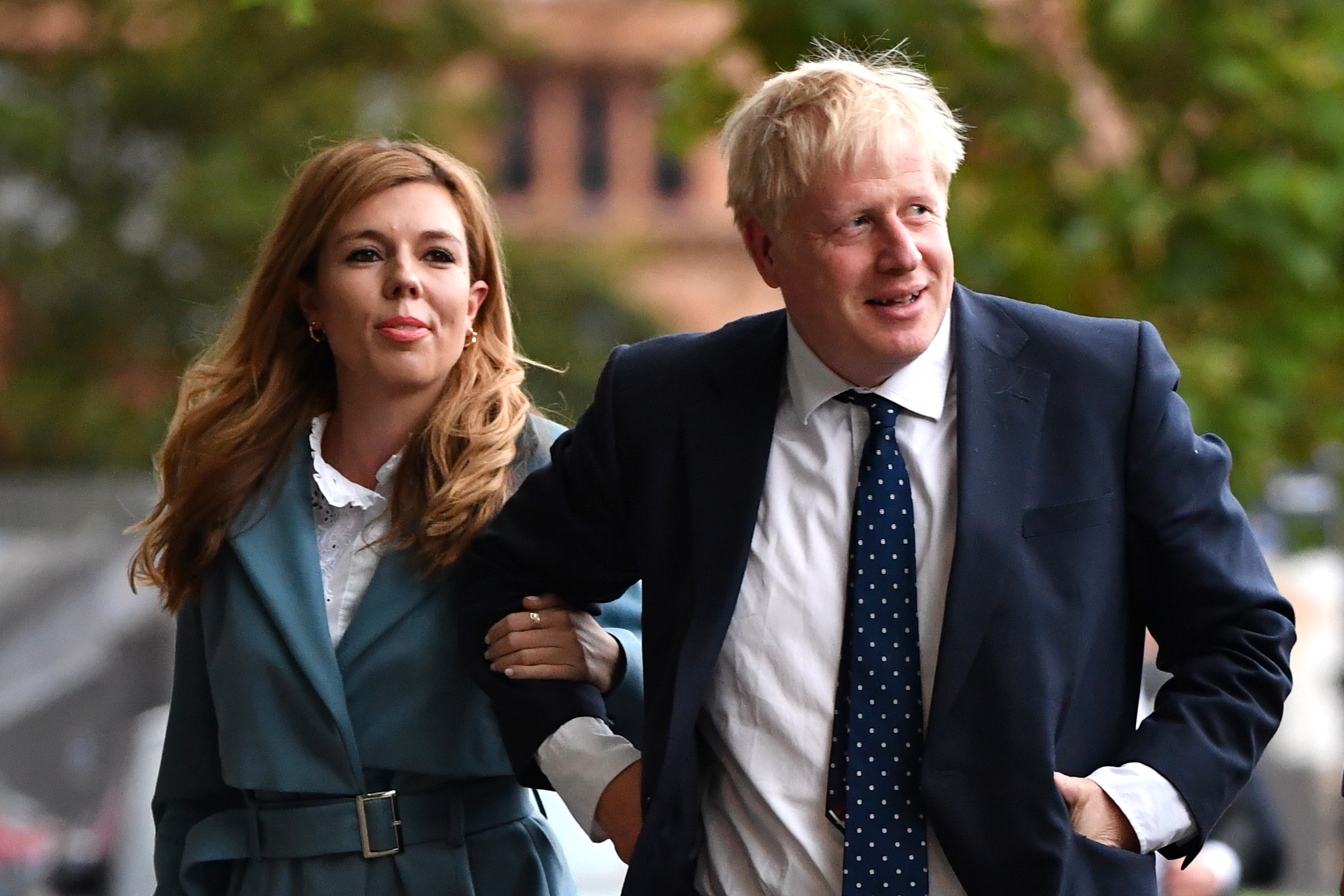 Boris Johnson and his girlfriend Carrie Symonds arrive at the Conservative Party conference yesterday