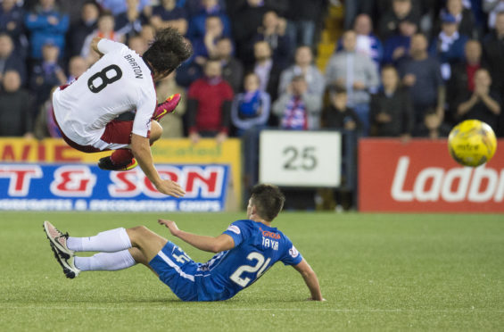 Kilmarnock's Greg Taylor  tackles Joey Barton