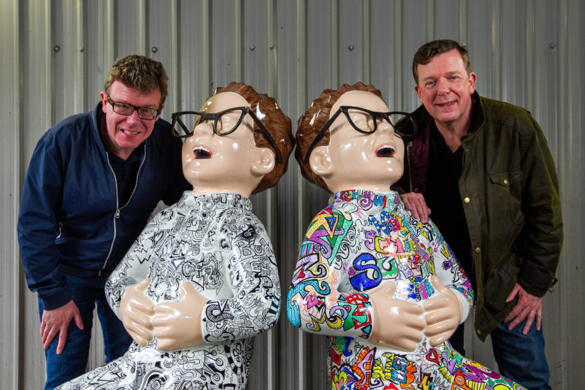 The Proclaimers, Charlie and Craig Reid, signing Oor Wullie statues for the Bucket Trail. The statues have been designed in honour of the Scottish singers. Pic shows Craig (L) and Charlie (R).
