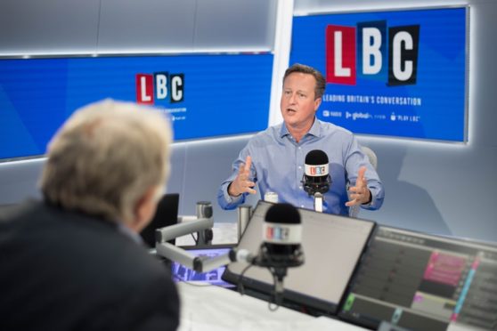 Former prime minister David Cameron during an interview with presenter Nick Ferrari in the LBC studios at Global Radio in Leicester Square, London.