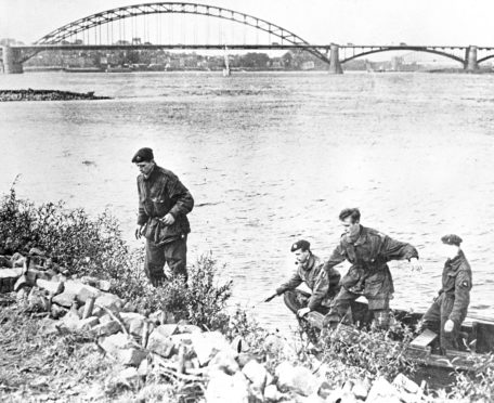 Four British paratroopers who were captured on the last outpost on Arnhem Bridge and taken captives to Germany are shown, as they later escaped through a German town and woods, to reach Nijmegen and the British Second Army after rowing across the Rhine in a boat they found