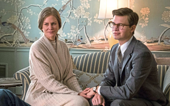 Nicole Kidman stars as the wife of a socialite friend who looks after Theo, right, played by Ansel Elgort