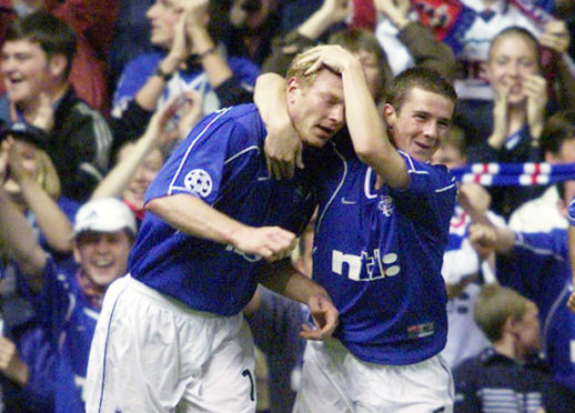 Jorg Albertz (left) celebrating with Barry Ferguson after scoring against Bayern Munich in the Champions League  at Ibrox