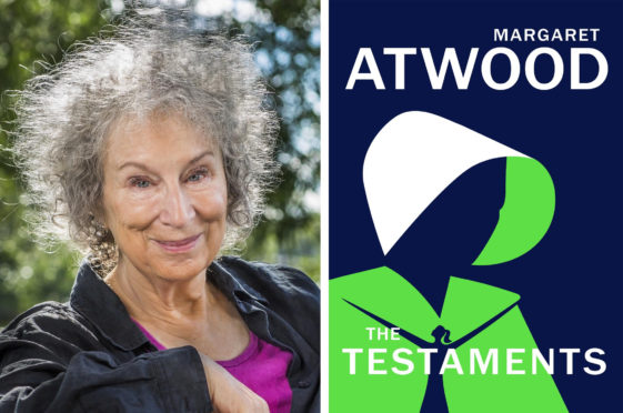 Margaret Atwood with the front cover of her book, The Testaments