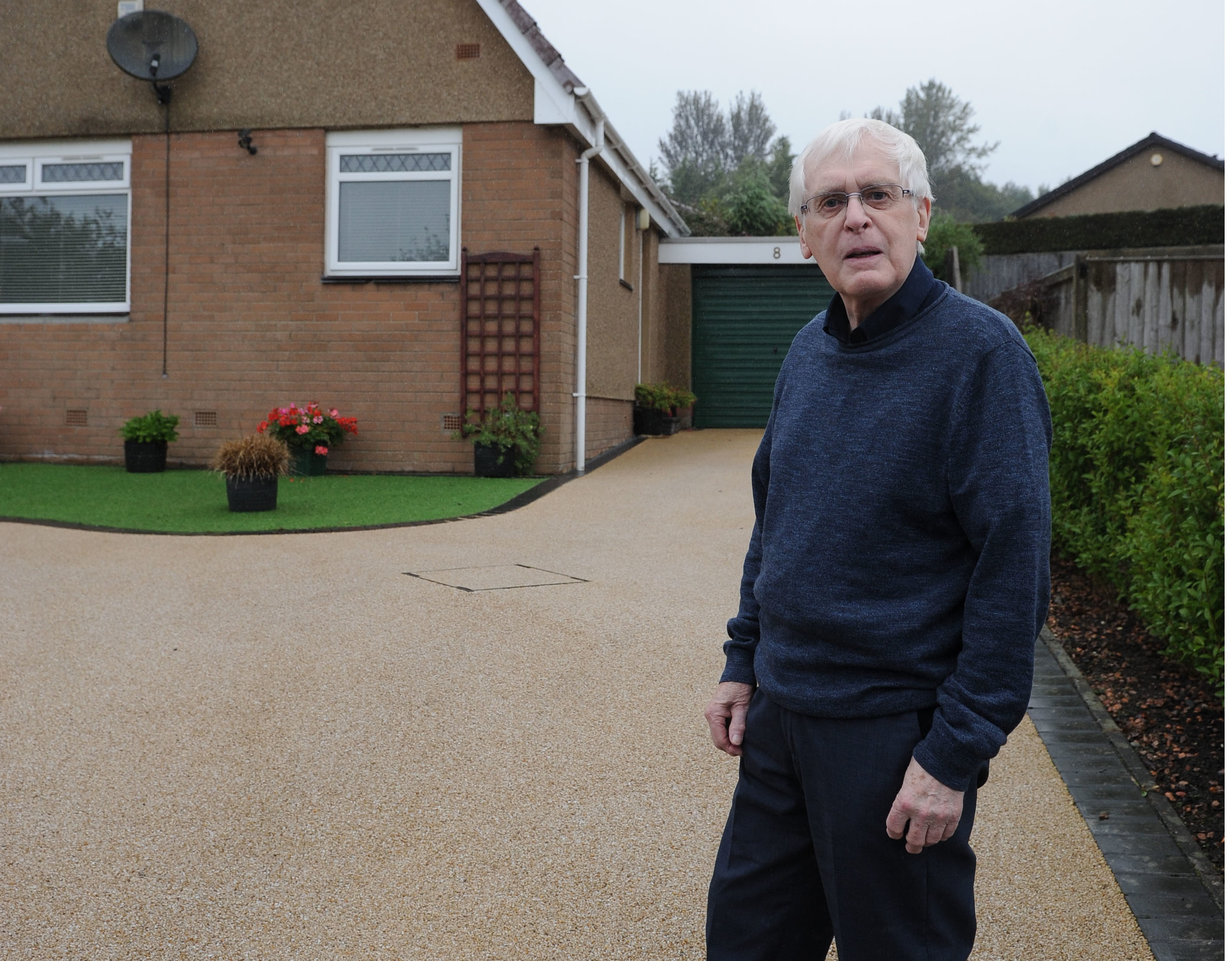 Douglas Paton paid £6k for a new driveway to be laid - but cheap material was used by a firm of "belligerent local cowboys" and the driveway surface has discoloured and is getting worse.