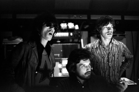 English musicians Keith Richards and Mick Jagger of the Rolling Stones along with producer Jimmy Miller work on the mixing of their "Let It Bleed" album at The Elektra Studios in October, 1969 in Los Angeles, California.