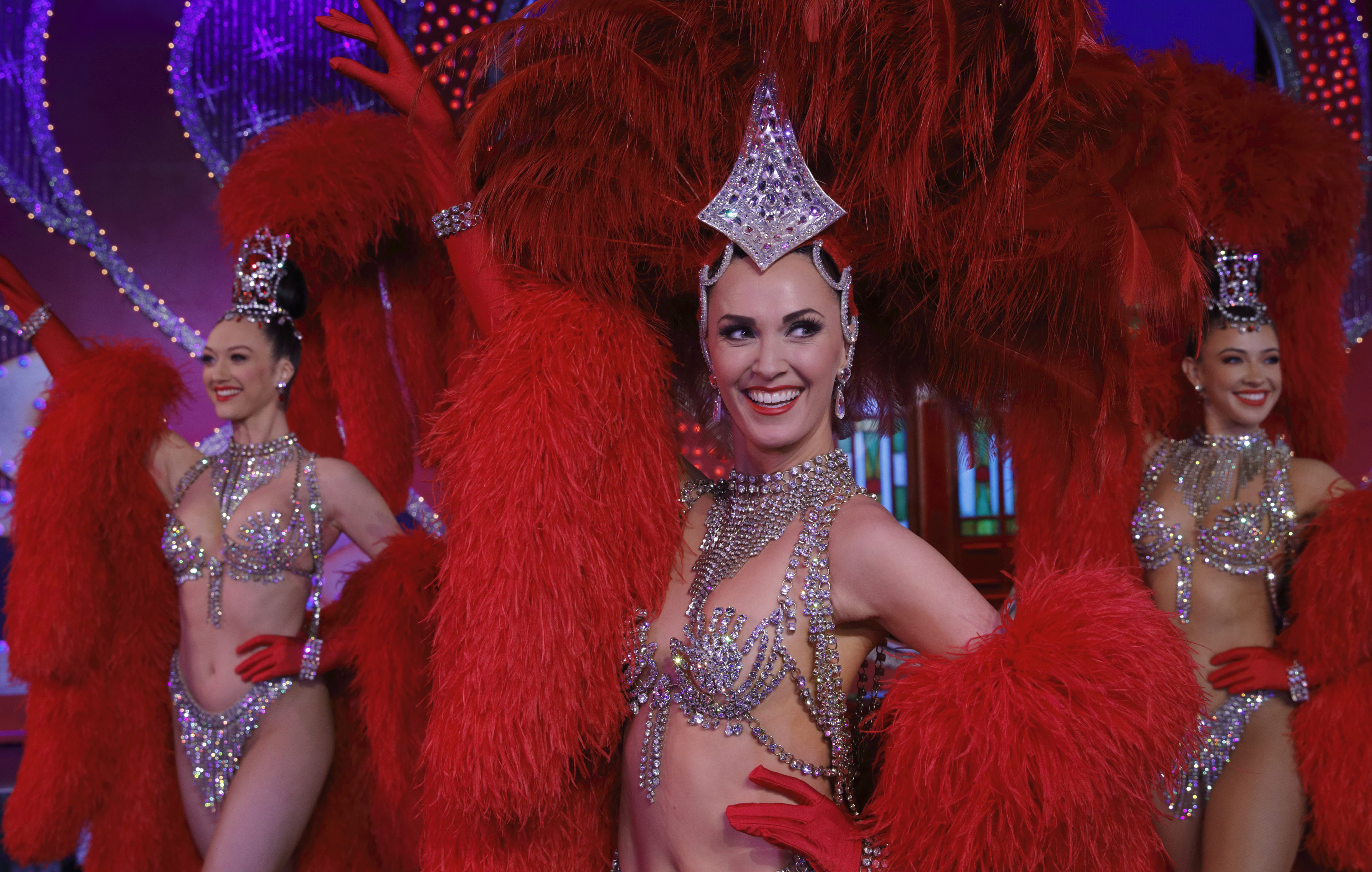 Dancers Lucy Monaghan, Sarah Tandy and Michaela Rondelli, left to right,                 on stage at the Moulin Rouge in Paris
