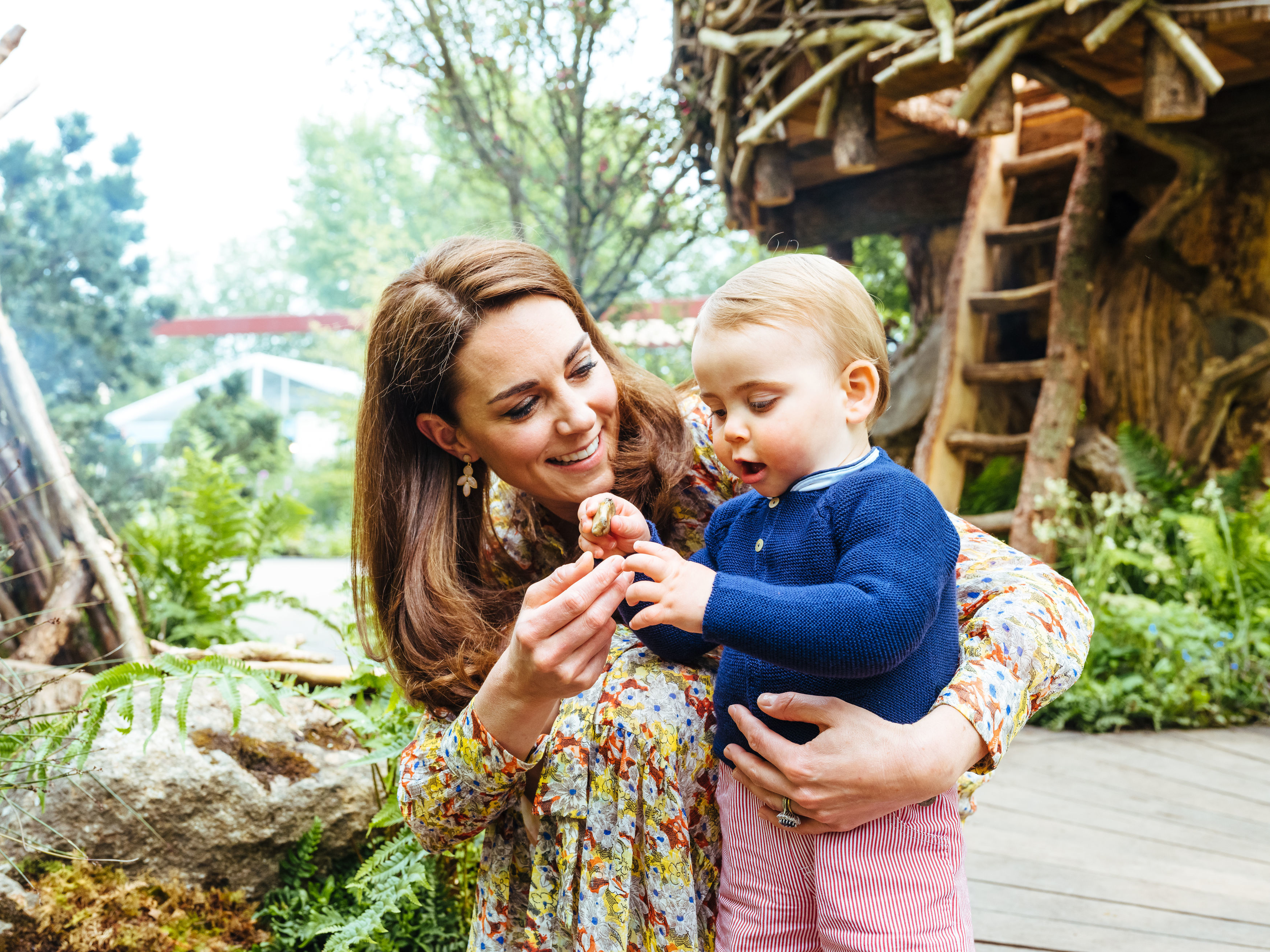 Duchess of Cambridge with Prince Louis in her garden at
Chelsea Flower Show.