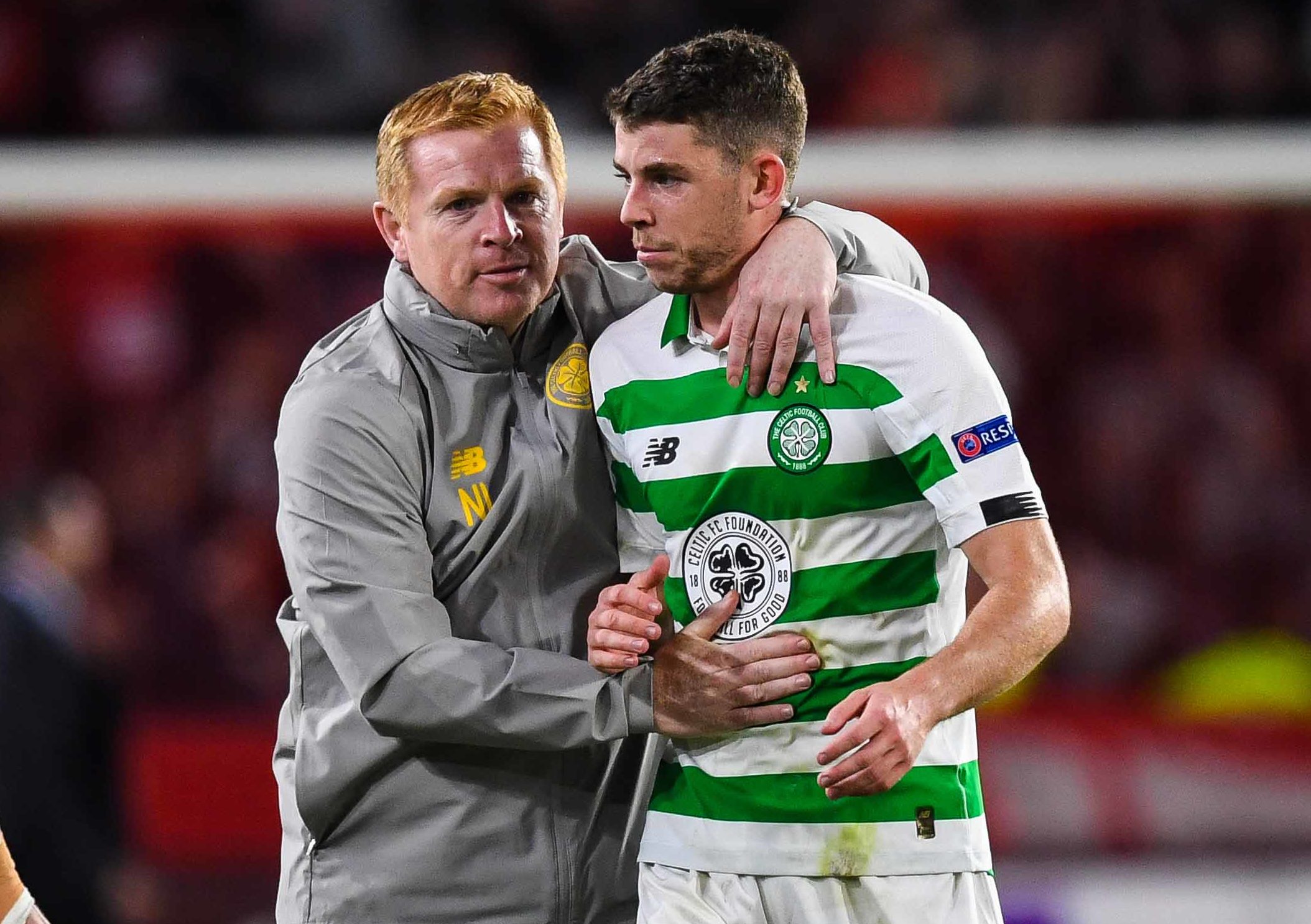 Celtic's Ryan Christie (R) and manager Neil Lennon at full-time of the UEFA Europa League Group E match between Stade Rennais and Celtic at Roazhon Park, on September 19, in Rennes, France