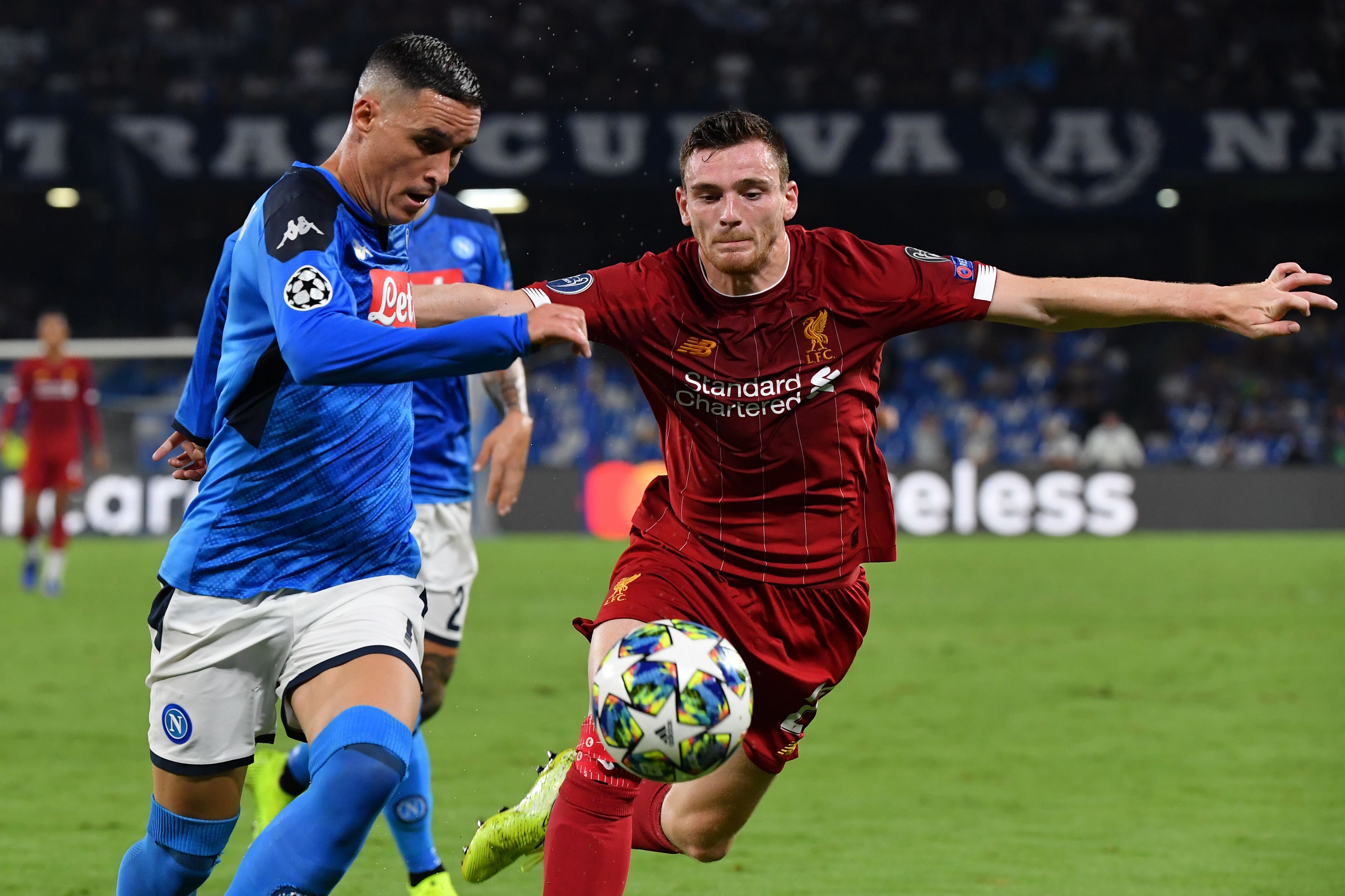 Napoli's Spanish forward Jose Callejon (L) challenges Liverpool's Scottish defender Andrew Robertson during the UEFA Champions League Group E football match Napoli vs Liverpool on September 17, 2019 at the San Paolo stadium in Naples.