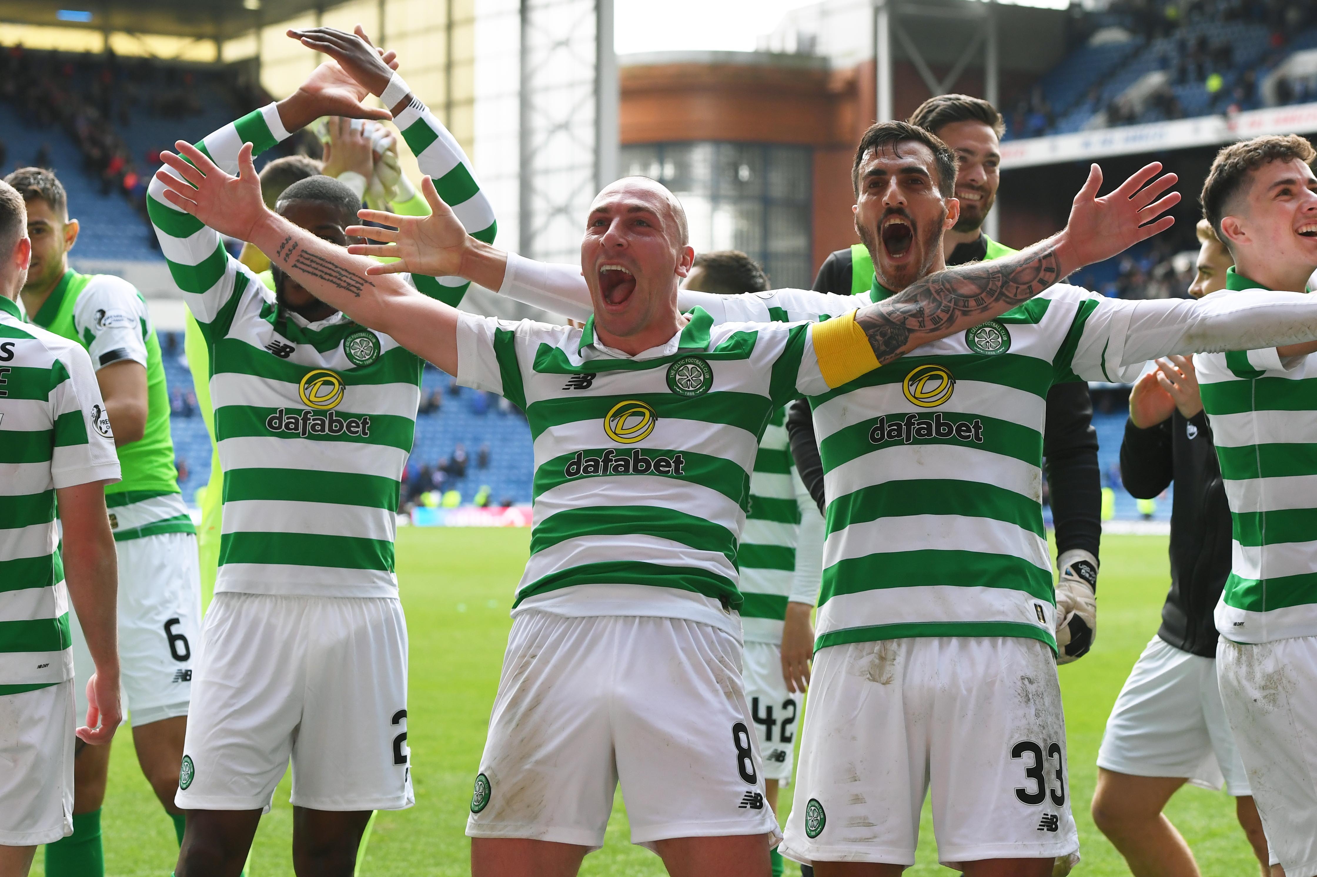 Celtic captain Scott Brown and his team-mates celebrate after beating Rangers 2-0 at Ibrox last Sunday