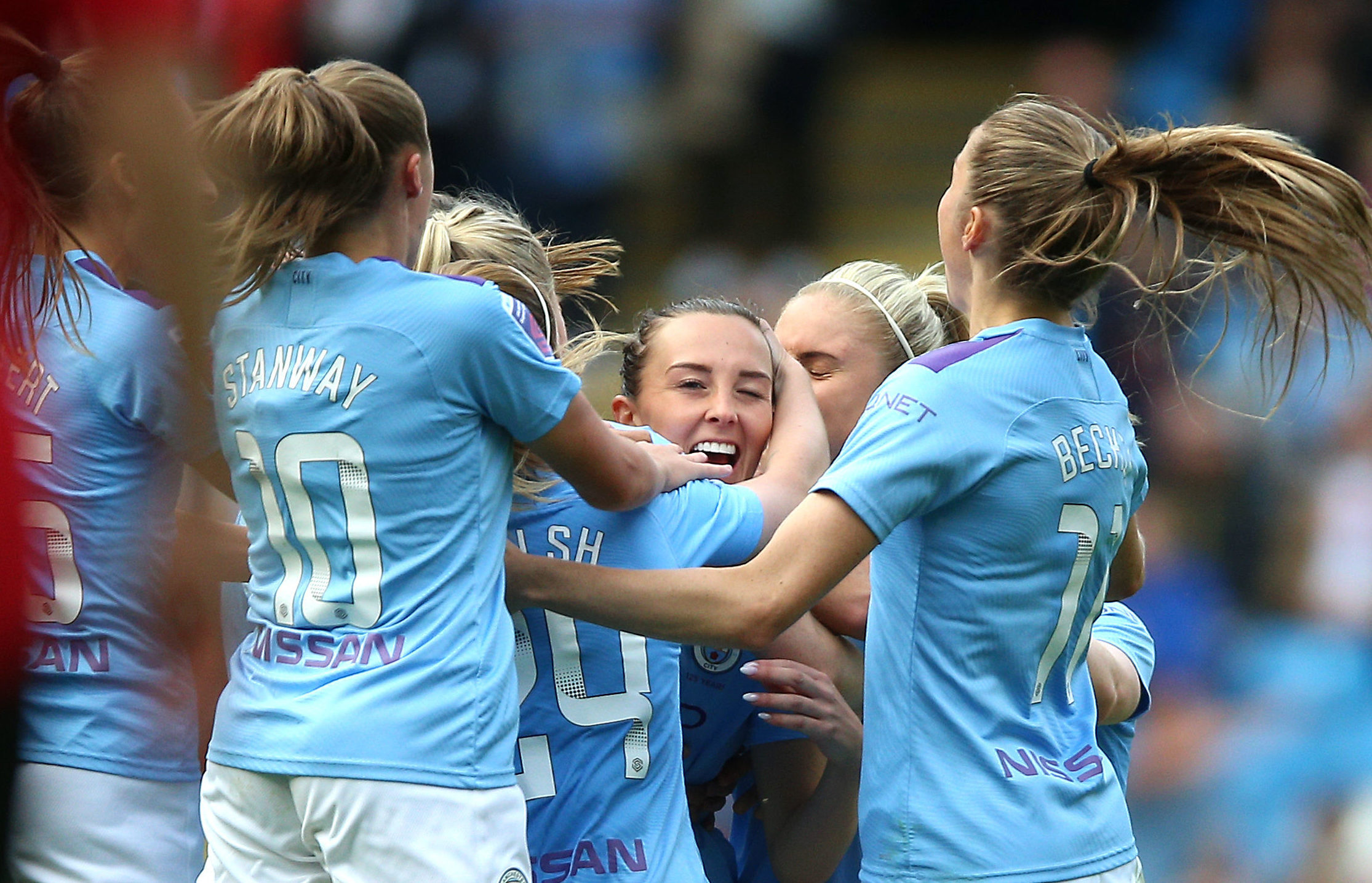 Manchester City Women's Caroline Weir (centre) celebrates with teammates