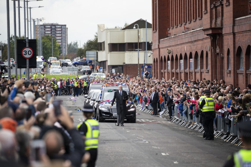 Supporters gather to pay tribute to former Rangers player Fernando Ricksen
