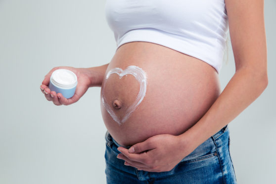 Rubbing the skin with rich body cream can help prevent stretch marks