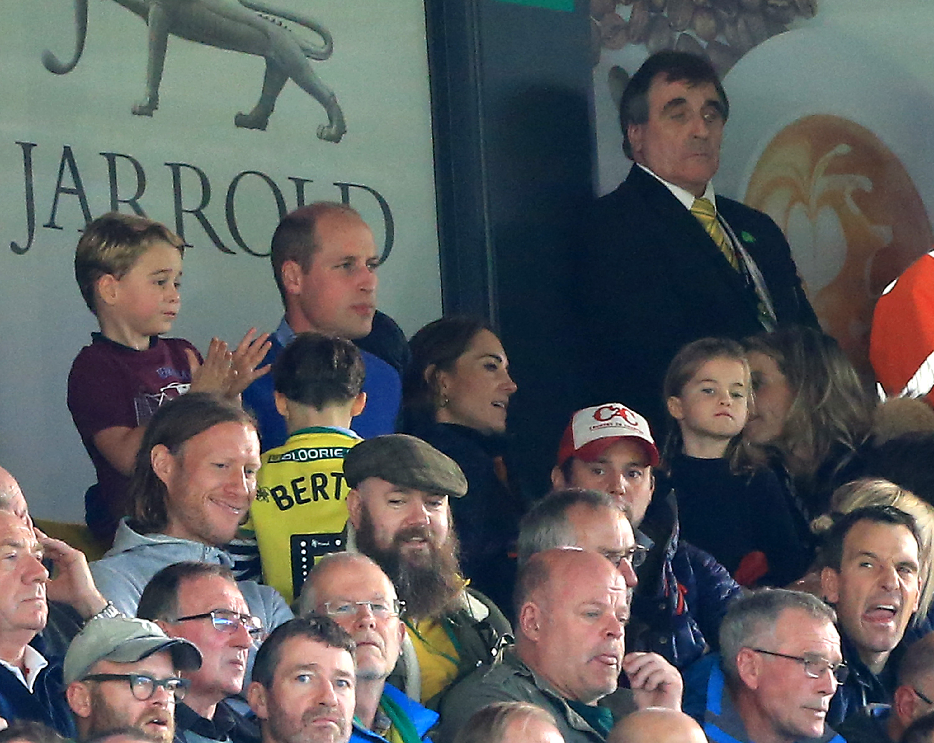 Prince George of Cambridge,  Prince William, Duke of Cambridge and Catherine, Duchess of Cambridge and Princess Charlotte of Cambridge are seen in the stands during the Premier League match between Norwich City and Aston Villa at Carrow Road.