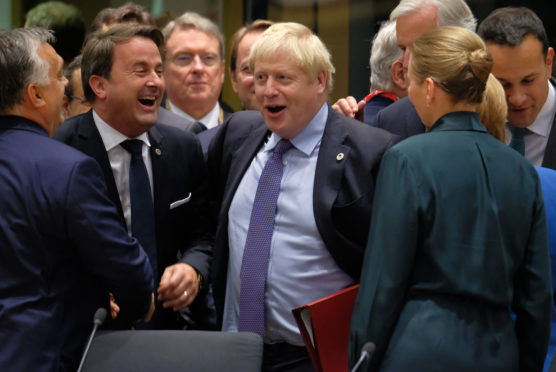 UK Prime Minister Boris Johnson and Luxembourg Prime Minister Xavier Bettel (L)