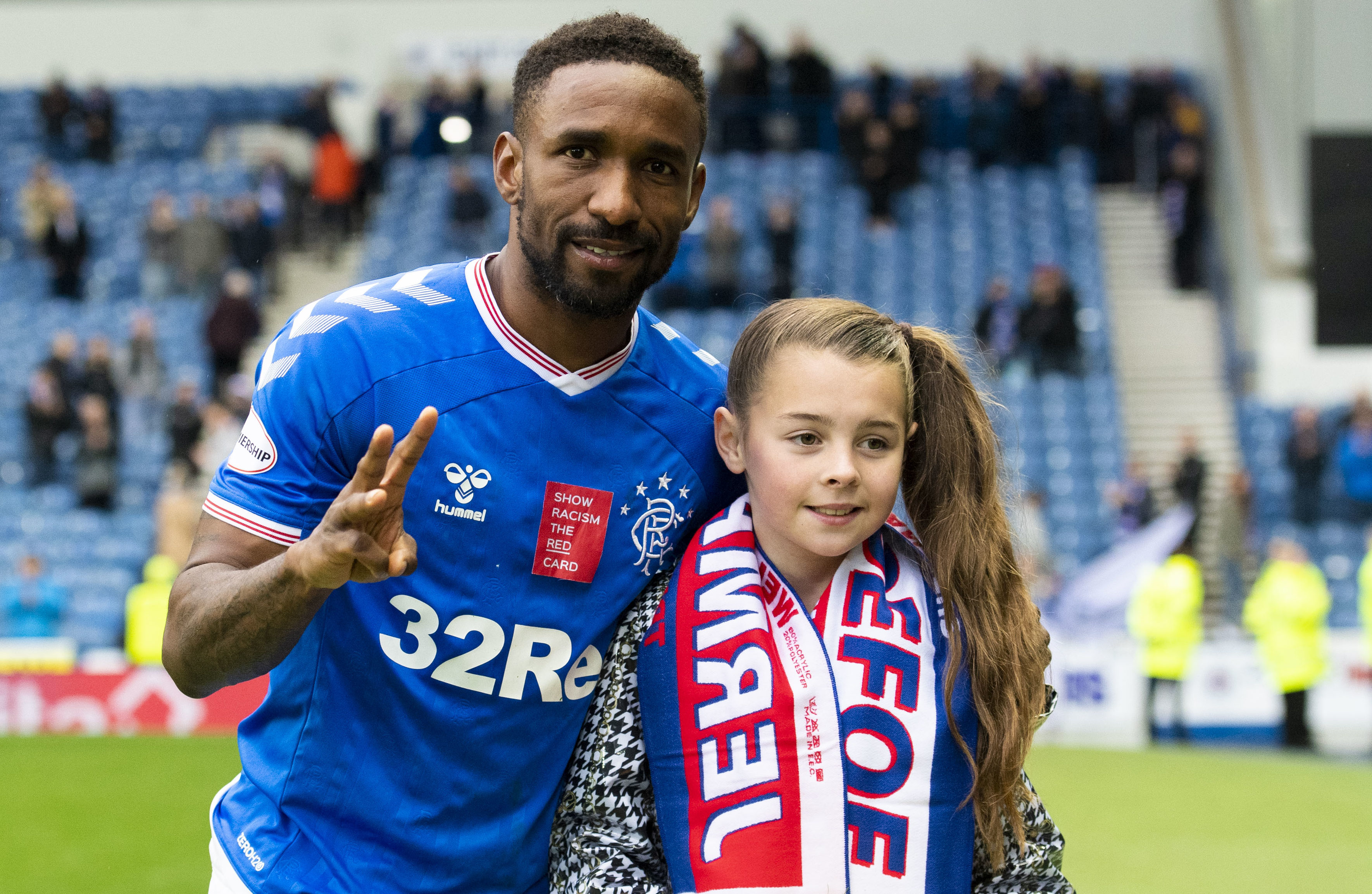 Jermain Defoe celebrates his hat-trick against Hamilton Accies last weekend with young fan Amber Smith