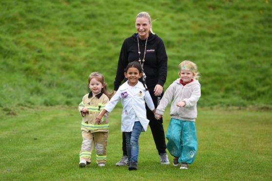 Children from Balmore Kindergarten in Glasgow dress up as what they want to be when they're older as part of a sponsored walk to raise money for young people affected by poverty.