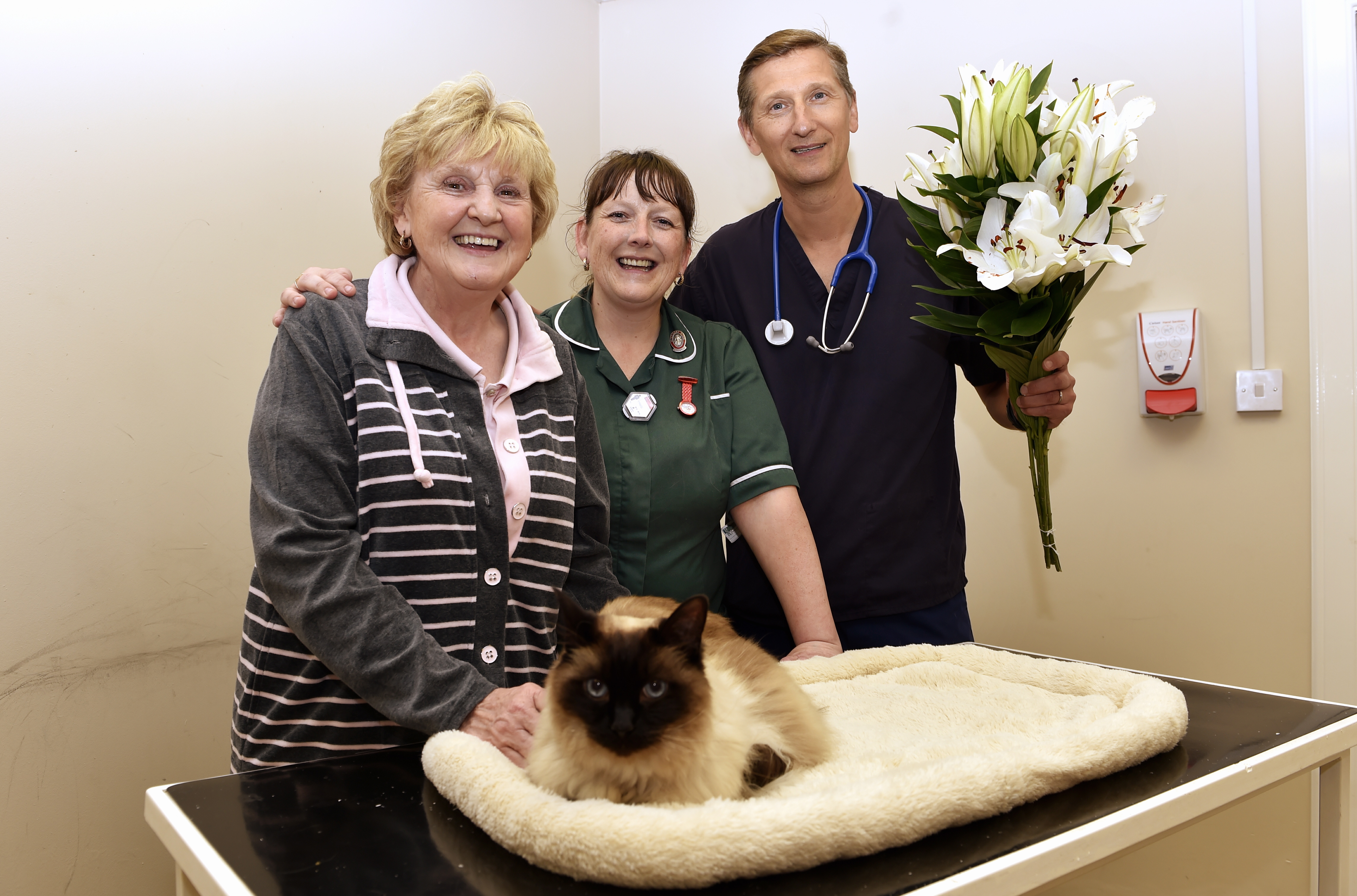 Coco with owner Wilma Kelly, from Wishaw, and Clyde Vets vet Hans Lambert and veterinary nurse Lisa Ferraioli