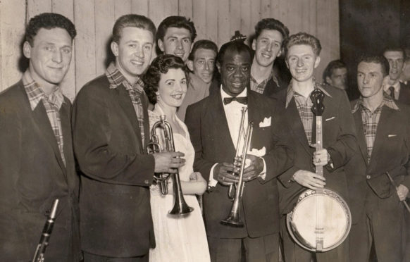 Mary McGowan, with jazz legend Louis Armstrong, centre, and the Clyde Valley Stompers