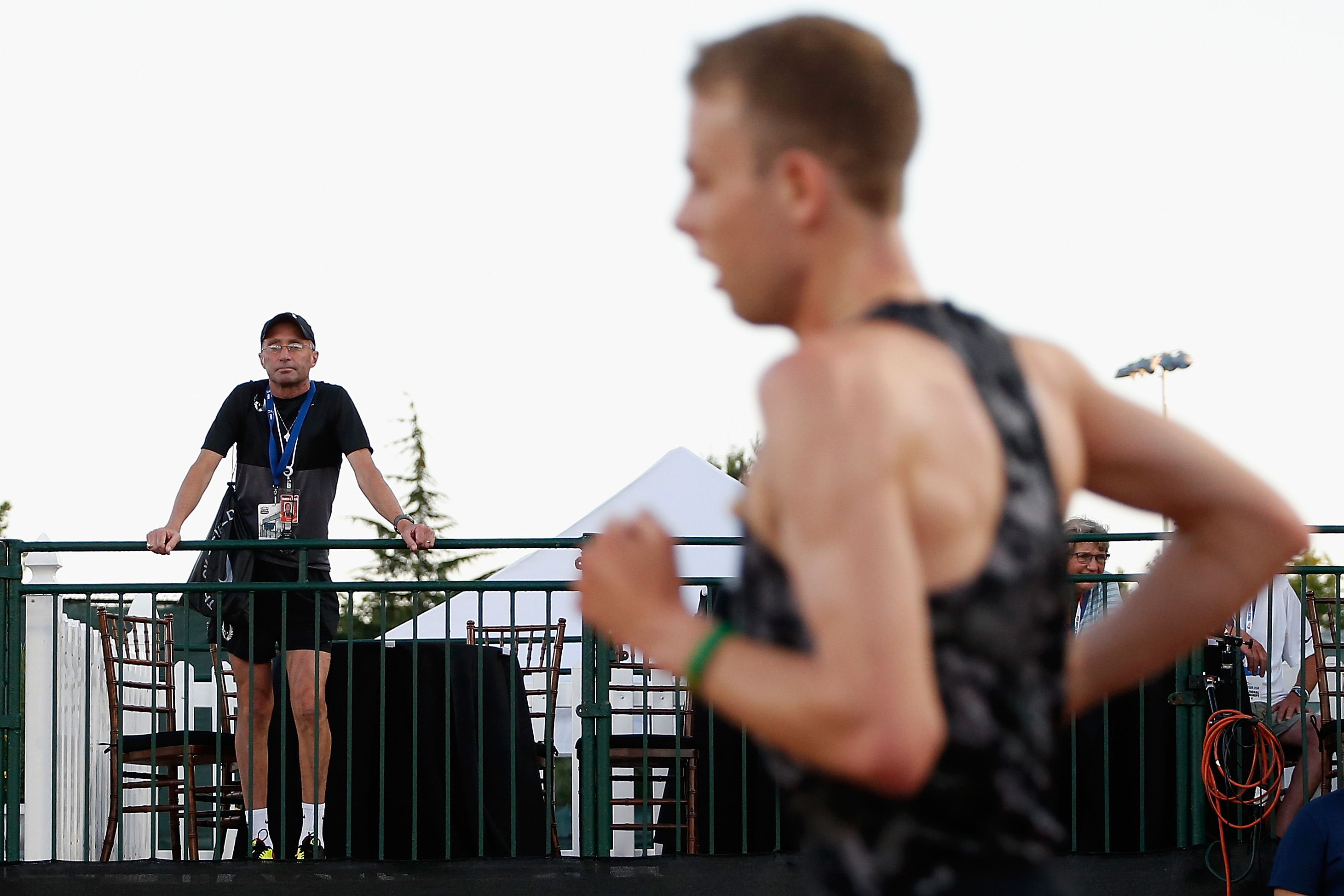 Alberto Salazar, left, looks on as Galen Rupp competes in Eugene, Oregon in 2015