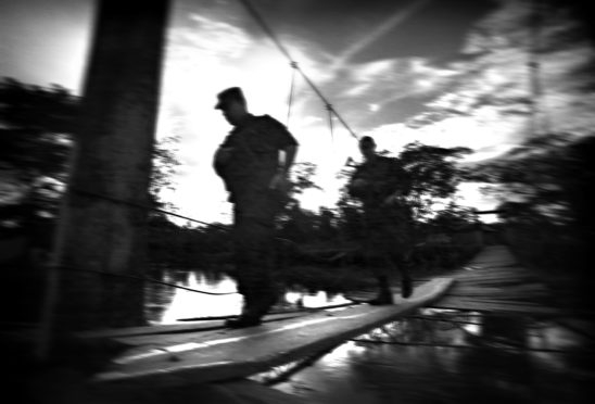 Members of the anti-guerrilla police on patrol in Bellavista, on the Atrato River