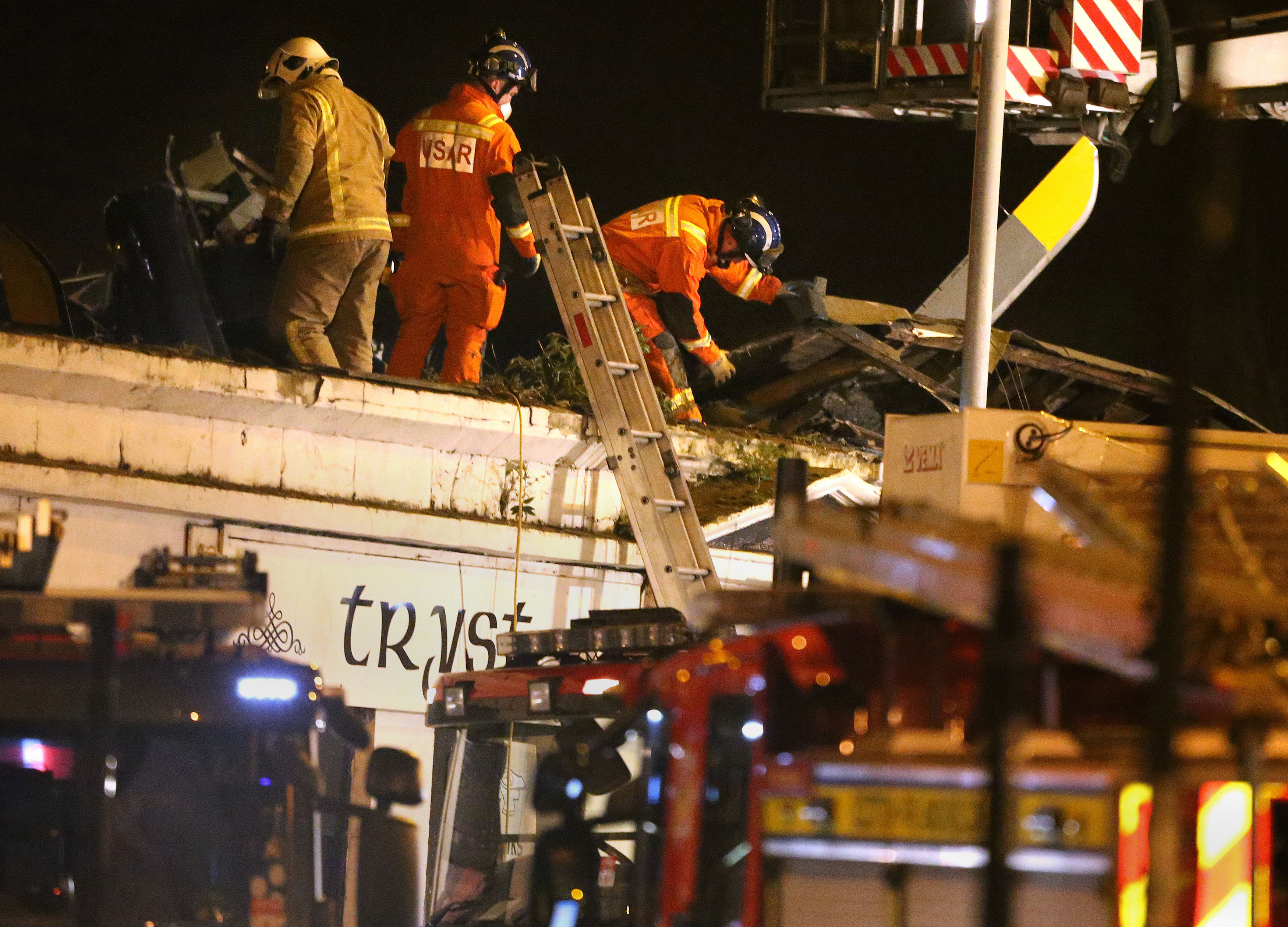 Rescue workers at the scene of the 2013 crash