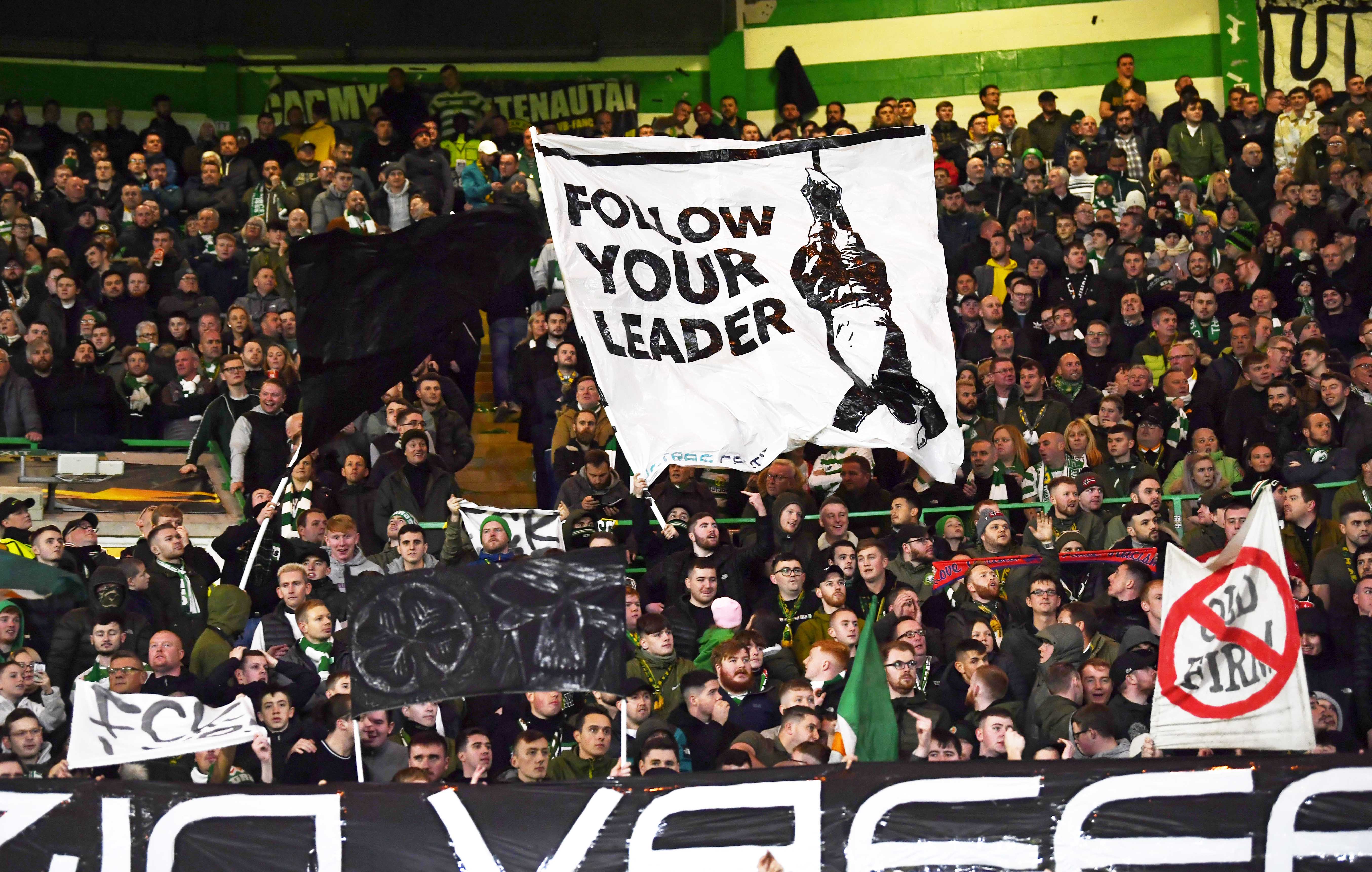 A banner depicting hanged Italian dictator Benito Mussolini is displayed by home supporters during Thursday’s Europa League match at Celtic Park