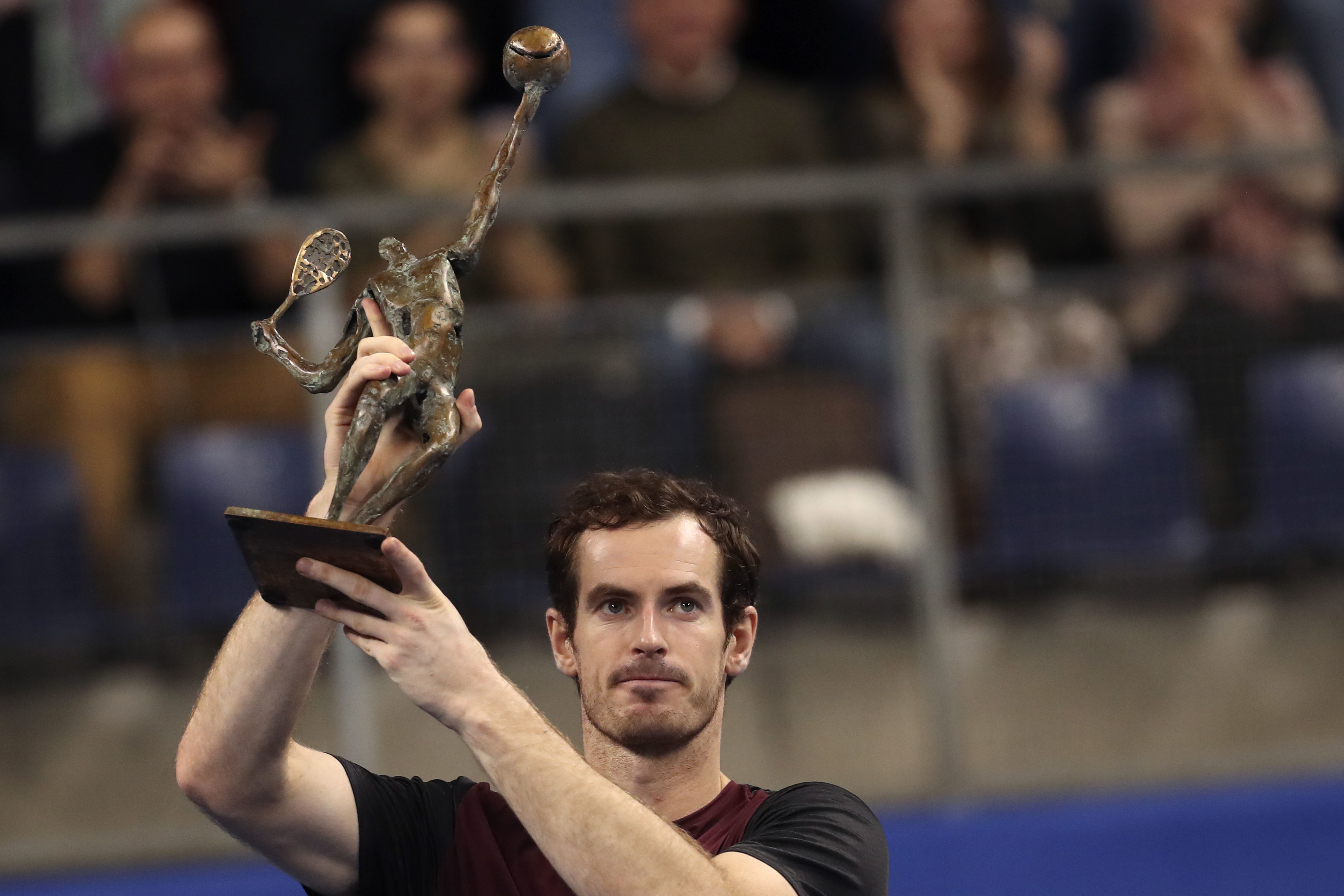 Andy Murray lifts the trophy after winning the European Open