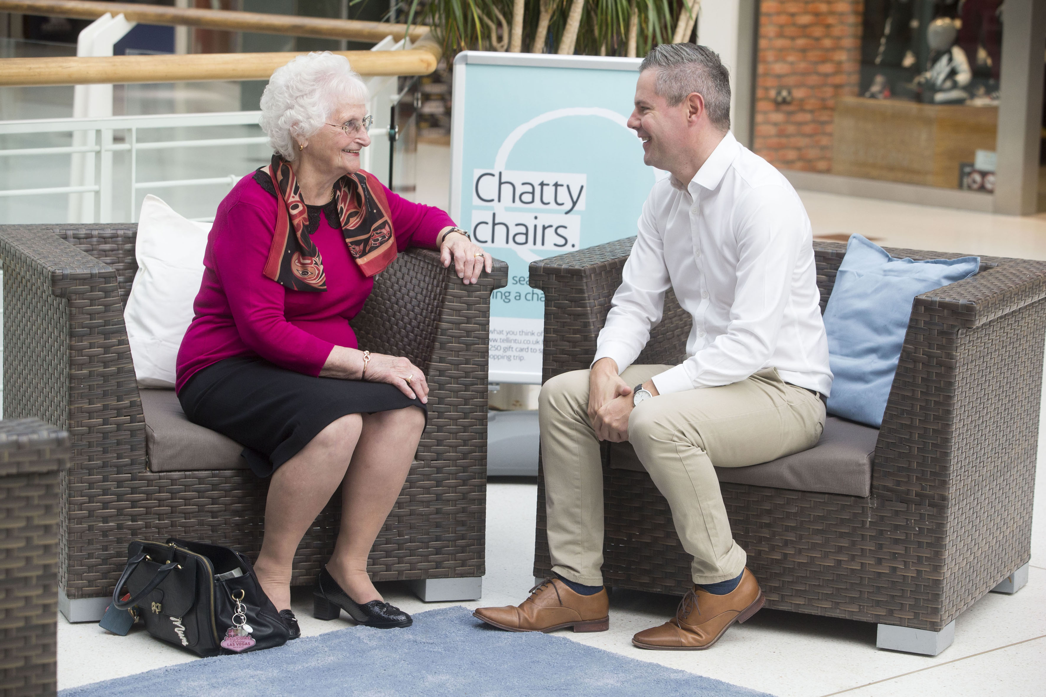 Ina Sellars, 79, from Paisley, talks to Finance Secretary, Derek MacKay on intu Braehead's new Chatty Chairs.