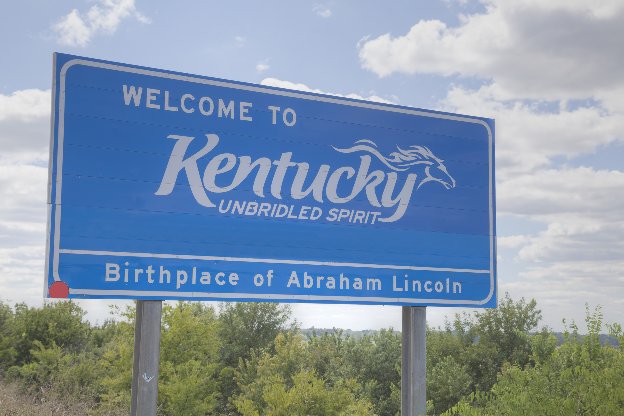 Welcome to Kentucky road sign at the state border.